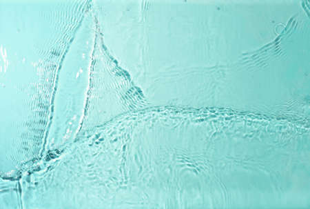 texture of splashing clean water on pastel backgroundの写真素材