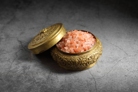 Himalayan pink salt in golden box at loft kitchenの写真素材