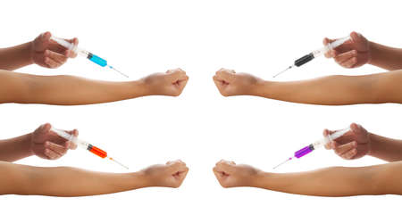 Doctor giving Covid-19 vaccine to himself isolated on white backgroundの写真素材