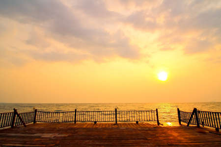 Picture of the bridge and sunset on the sea 