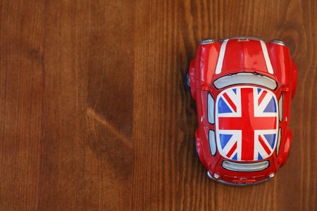 Red Mini Cooper model on wood backgroundの写真素材