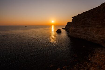 Sunset on the rocky seashore, Cape Fiolent, Crimeaの写真素材