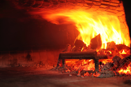 Fire wood burning in the ovenの写真素材