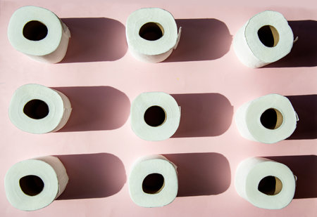 Toilet paper on a pink background. Toilet paper pattern.の写真素材
