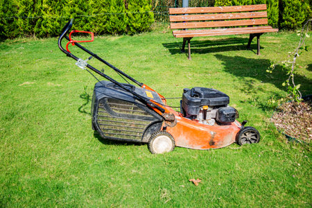 Lawn mower in the garden. Gardening, agriculture.の写真素材