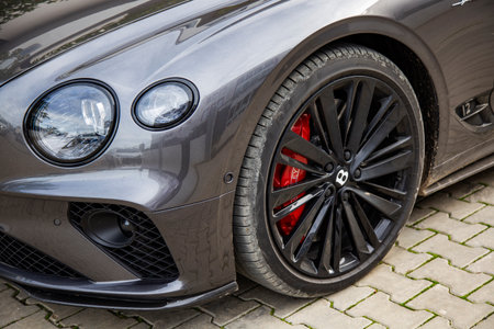 Izmir, Turkey - January 2024: Bentley gray color car headlights and wheels close-up
