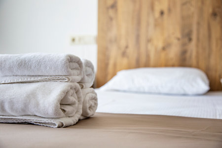 Clean towels on the bed in the hotel room. Selective focus.の写真素材