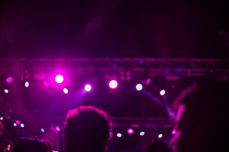 Stage lights and crowd of people at a music festival. blurred backgroundの写真素材