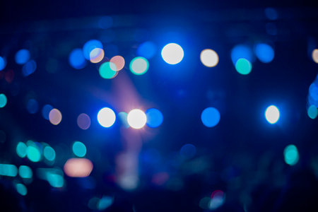 blurred concert stage lights bokeh, abstract music blue clolor lights backgroundの写真素材