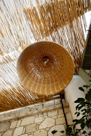 Bamboo umbrellas on the terrace of a restaurant.の写真素材