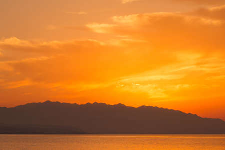 Golden sunset in Crete with clouds. Rethymno viewの写真素材