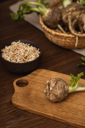 Celery root in close up on a cutting board, sliced dried root vegetable in a plateの写真素材