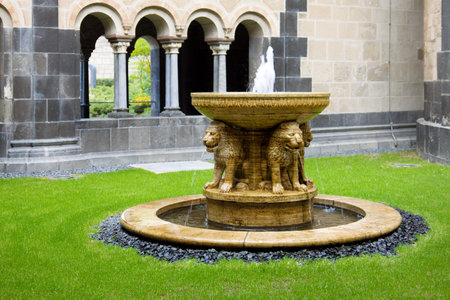 The Lion fountain in the courtyard of the Maria Laach abbey in Germany. The Maria Laach abbey is a Benedictine abbey situated in the Eifel region of the Rhineland-Palatinate in Germany. It was founded in 1093.  The Lion Fountain in the courtyard was addedのeditorial素材