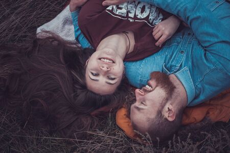 Happy Young Couple in Winter Park having fun.Family Outdoors. loveの写真素材