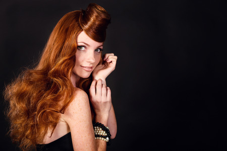 Fashion Portrait Of Luxury Woman With Red hair. hairstyle looks like a hat.の写真素材
