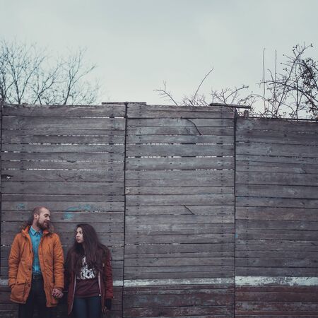 Happy Young Couple in Winter Park having fun.Family Outdoors. love