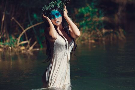 Young drown woman in a poetic representation.  The concept of the undead dark tales and legendsの写真素材