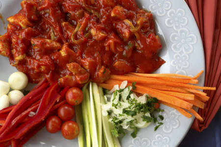 A chicken with sauce ready for eatingの写真素材