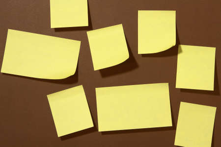 A lot of Post-it on brown background