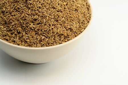 A Bowl of Anise Seed on whiteの写真素材