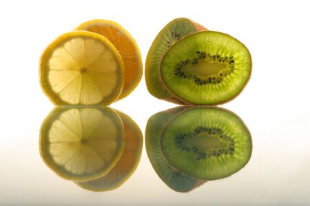 Slices of fresh fruit êèâè and ëåìîíàの写真素材