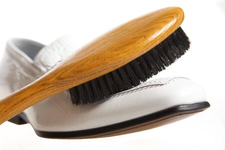 White shoe and brush for cleaningの写真素材
