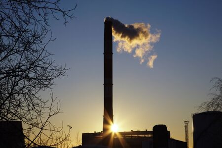 Silhouette of the Power plant at sunsetの写真素材