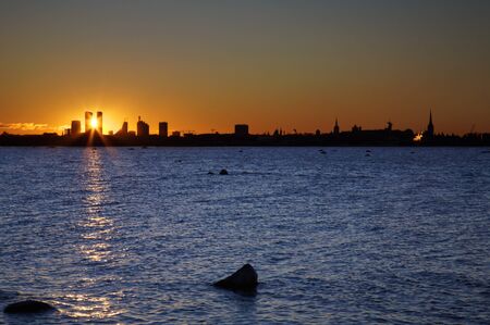 Sunset over a silhouette of Tallinn skylineの写真素材