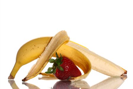 Ripe strawberry and banana on a white backgroundの写真素材