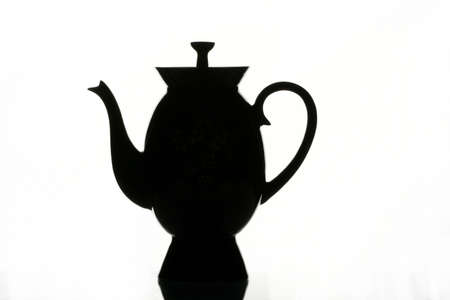 Black cup and teapot on a white backgroundの写真素材
