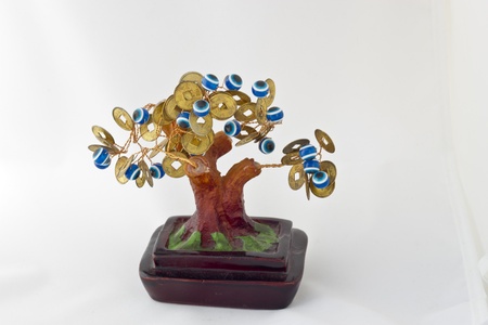 Souvenir monetary tree on a white backgroundの写真素材