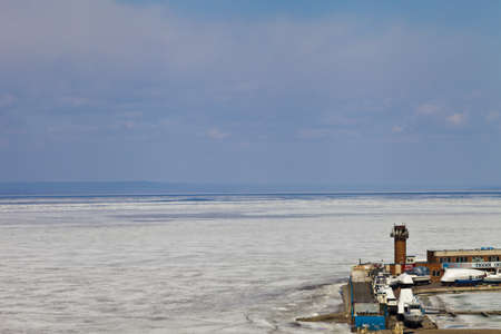 Sea landscape in the winter with the water covered with iceの写真素材