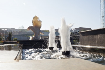 Fountains in a house yard in beams of the morning sunの写真素材