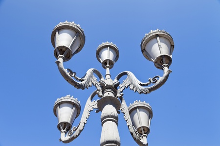 Street retrolamp against the bright blue morning skyの写真素材
