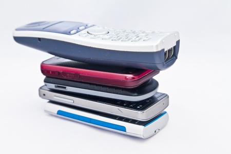 Mobile phones separately and together, sometimes with a hand of the womanの写真素材