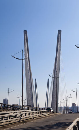 Big suspension bridge in beams of the bright spring sun