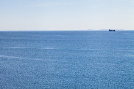 Sea landscape in beams of the bright summer sunの写真素材