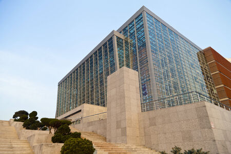 The modern building in beams of the setting autumn sun