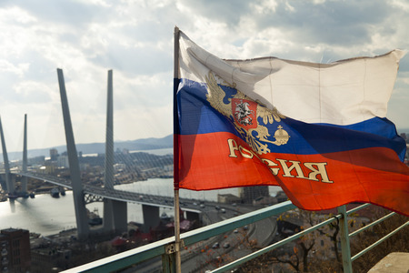 The Russian flag is rinsed on a wind under a bright sunの写真素材