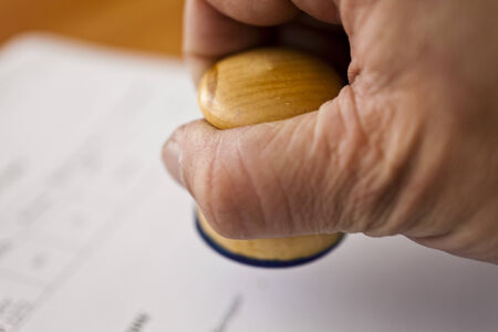 Table at office with papers, the calculator and a stationery