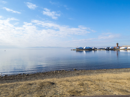 The seashore in the city in sunny autumn day