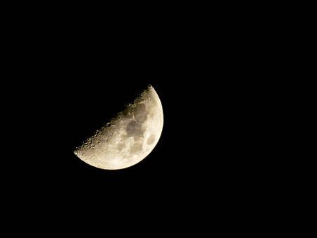 The moon in the night sky shines, but doesn't heatの写真素材