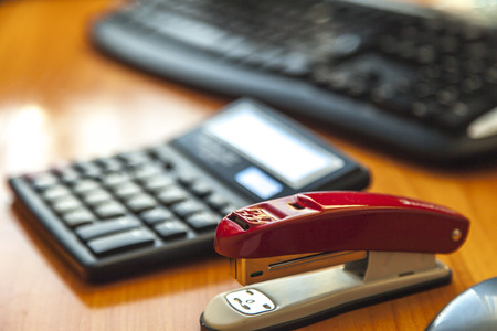At office among office accessories and office equipmentの写真素材