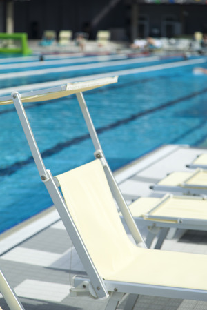 The swimming pool under beams of the sun is ready to competitions and restの写真素材