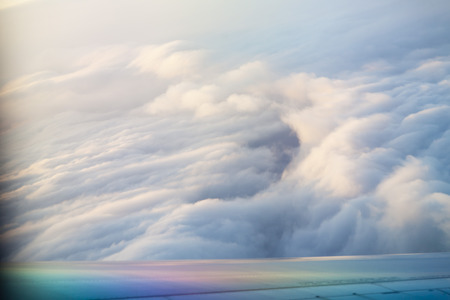 The view from the airplane window at the clouds and the heavensの写真素材