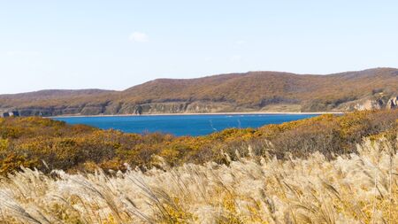 The sea under the bright autumn sun prepares for winterの写真素材