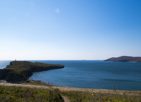 The sea under the bright autumn sun prepares for winterの写真素材