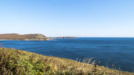 The sea under the bright autumn sun prepares for winterの写真素材