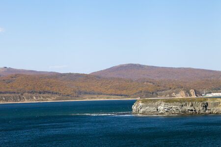 The sea under the bright autumn sun prepares for winterの写真素材