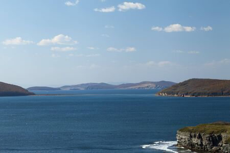 The sea under the bright autumn sun prepares for winterの写真素材